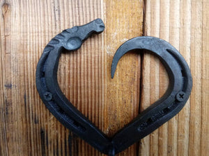 Horseshoe heart horse head hook, hand forged.