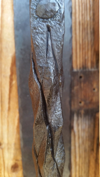 Hand forged railroad spike door handle with pineapple twist